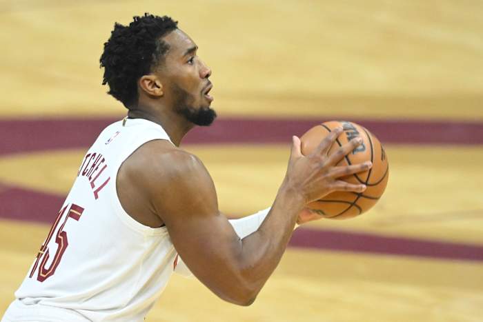 Dec 18, 2023; Cleveland, Ohio, USA; Cleveland Cavaliers guard Donovan Mitchell (45) shoots in the first quarter against the Houston Rockets at Rocket Mortgage FieldHouse.